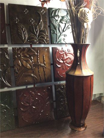 Large metal wall hanging with matching floor vase